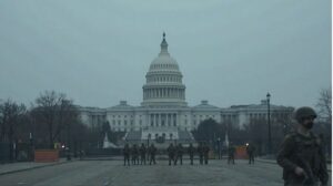 The U.S. Capitol in Washington D.C. during the government shutdown, showing security barriers and National Guard patrols amid budget and political tensions.